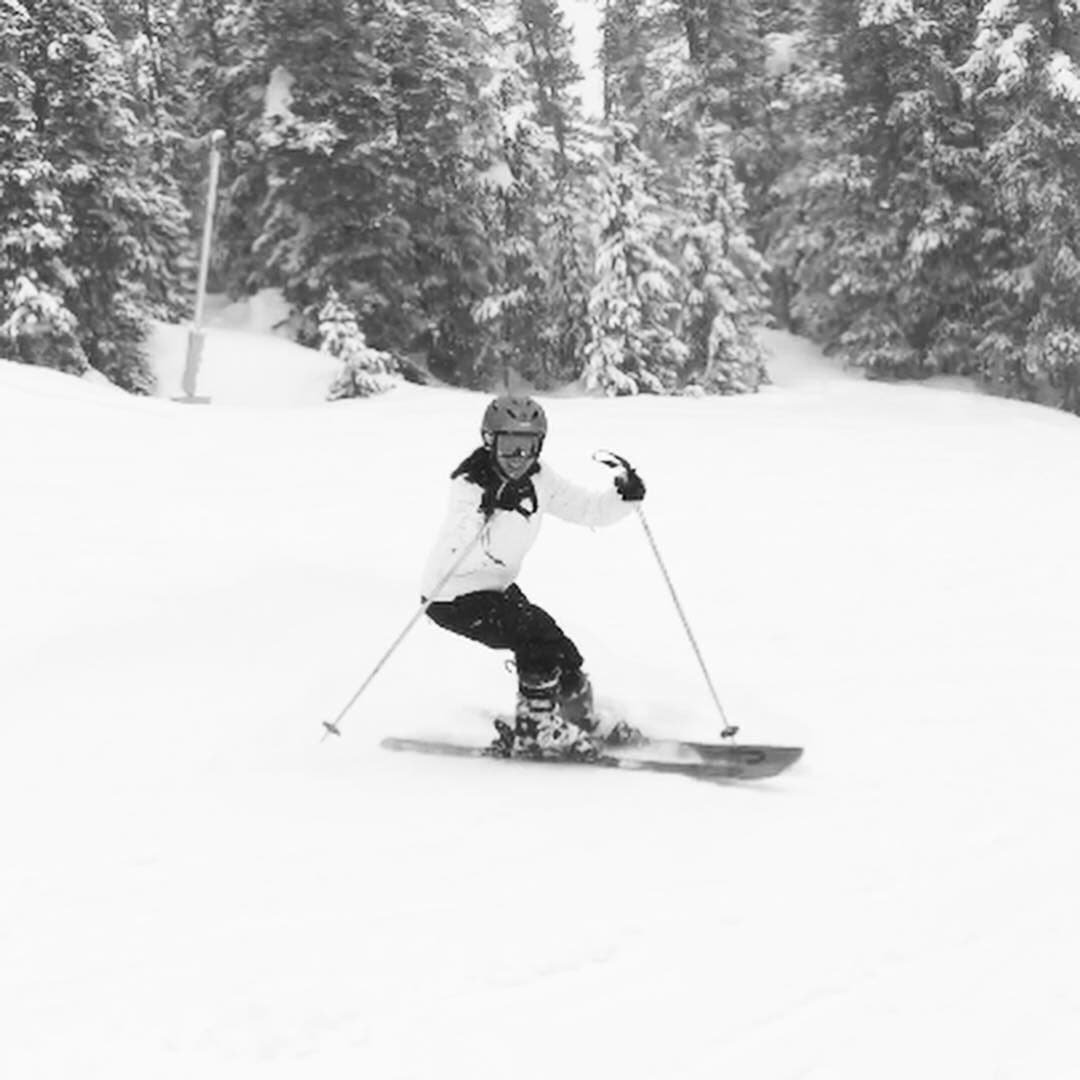 Roslyn skiing down a snowy slope
